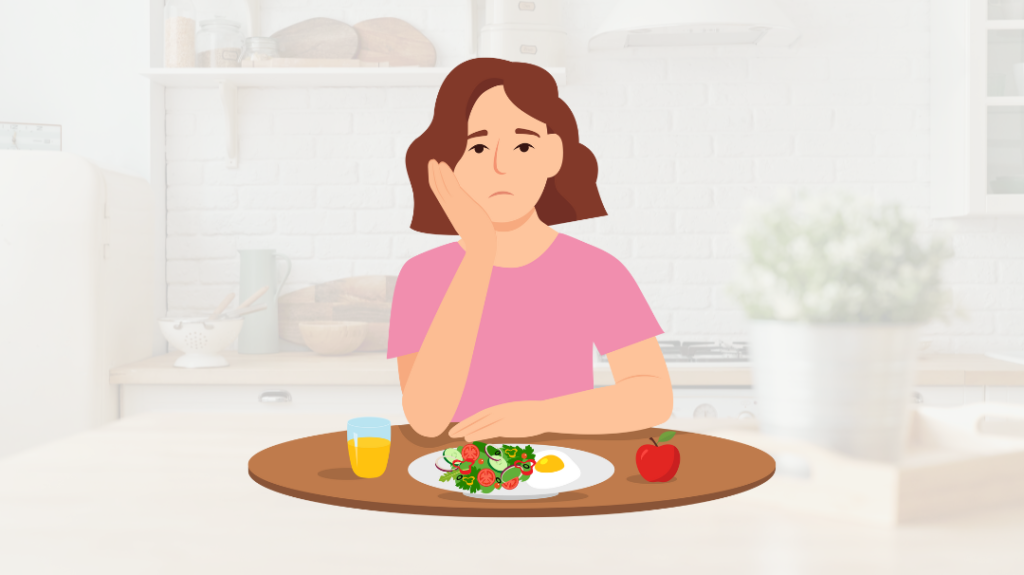 An illustration of a young woman with a sad expression sitting at a kitchen table, resting her chin on her hand and looking down at a plate of food containing salad and eggs.