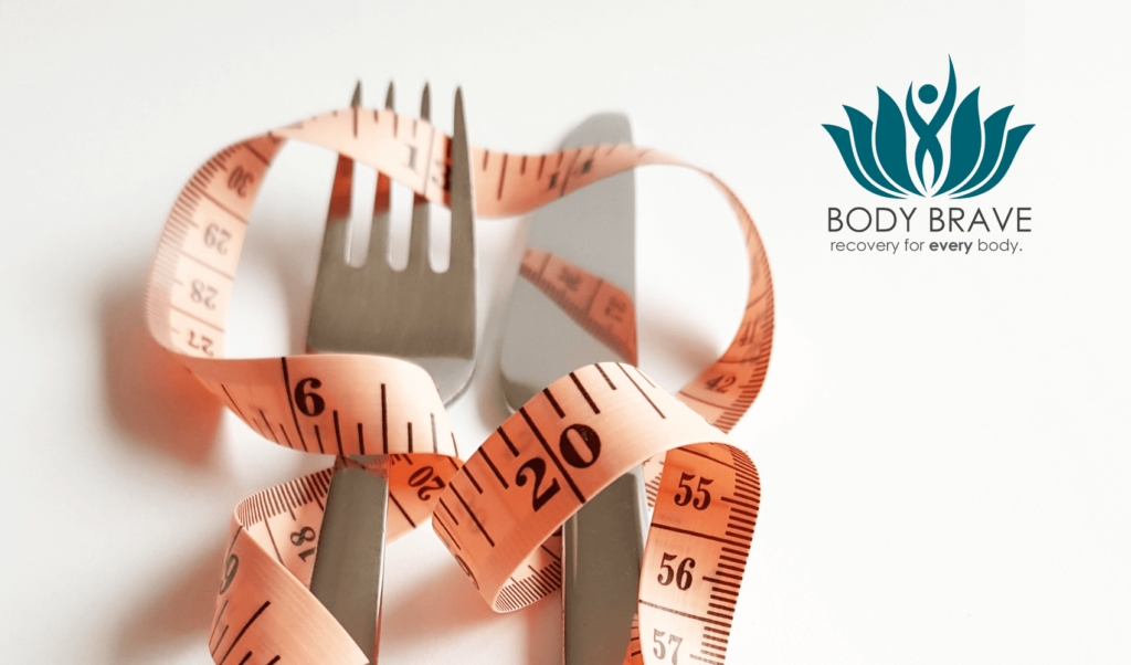 A close-up shot of a silver fork and knife laid side by side on a white surface, with a pastel orange measuring tape loosely wrapped around them. A logo in the top right corner features a stylized teal figure inside a lotus flower with the text "BODY BRAVE recovery for every body."
