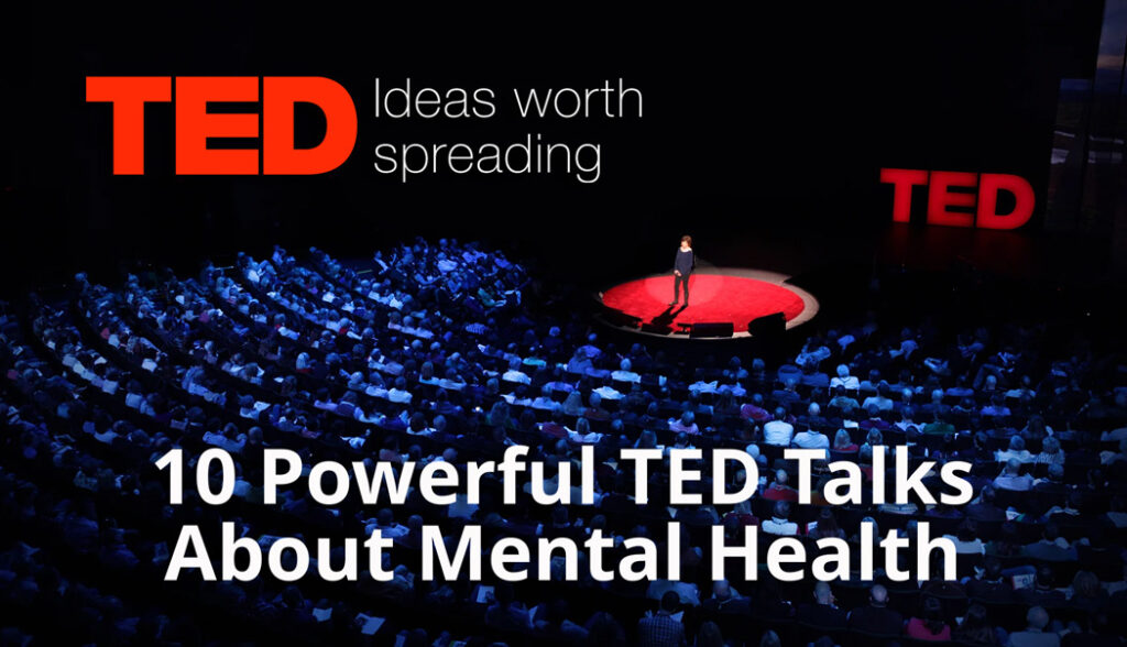 A high-angle photograph of a TED Talk stage viewed from the audience seating area. A speaker stands on a circular red stage under a bright spotlight. In the upper left corner, the large red "TED" logo appears alongside the white tagline "Ideas worth spreading". Overlaid in large bold white text across the middle of the image is the title, "10 Powerful TED Talks About Mental Health".