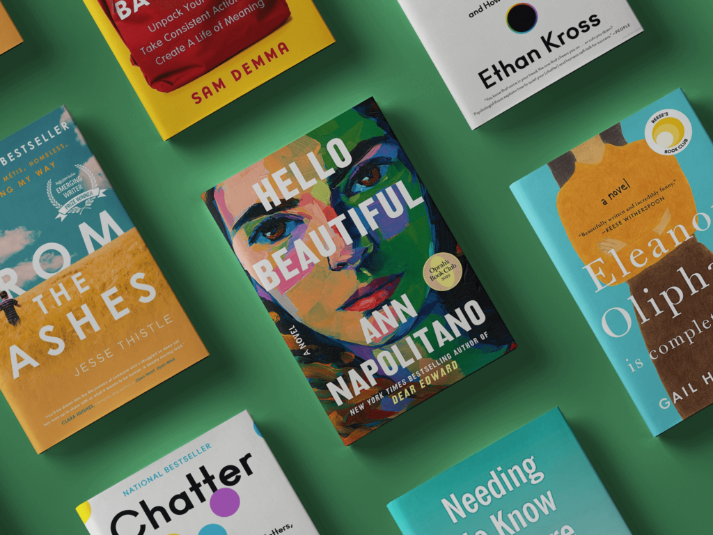 A top-down view of five books arranged on a green background, including 'From the Ashes', 'Hello Beautiful', 'Chatter', 'Eleanor Oliphant Is Completely Fine', and 'Needing to Know'.