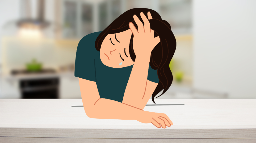 A close-up, digital illustration of a distressed young woman with long dark hair sitting at a table or counter against a softly blurred indoor background. She is leaning forward with her head downcast, resting one hand flat on the surface while her other hand holds her forehead in a gesture of exhaustion or deep sadness. A single tear falls from her eye down her pale cheek.