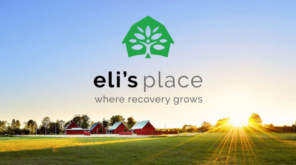 A sunny field at Eli's Place featuring red farm buildings, a bright sunburst, and the organization's logo and tagline, "where recovery grows."