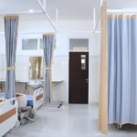 Mental Health Emergencies. An empty hospital ER with beds and curtains